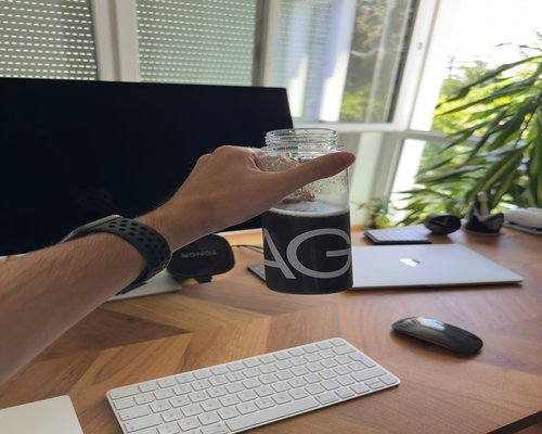 Person drinking water at an office desk